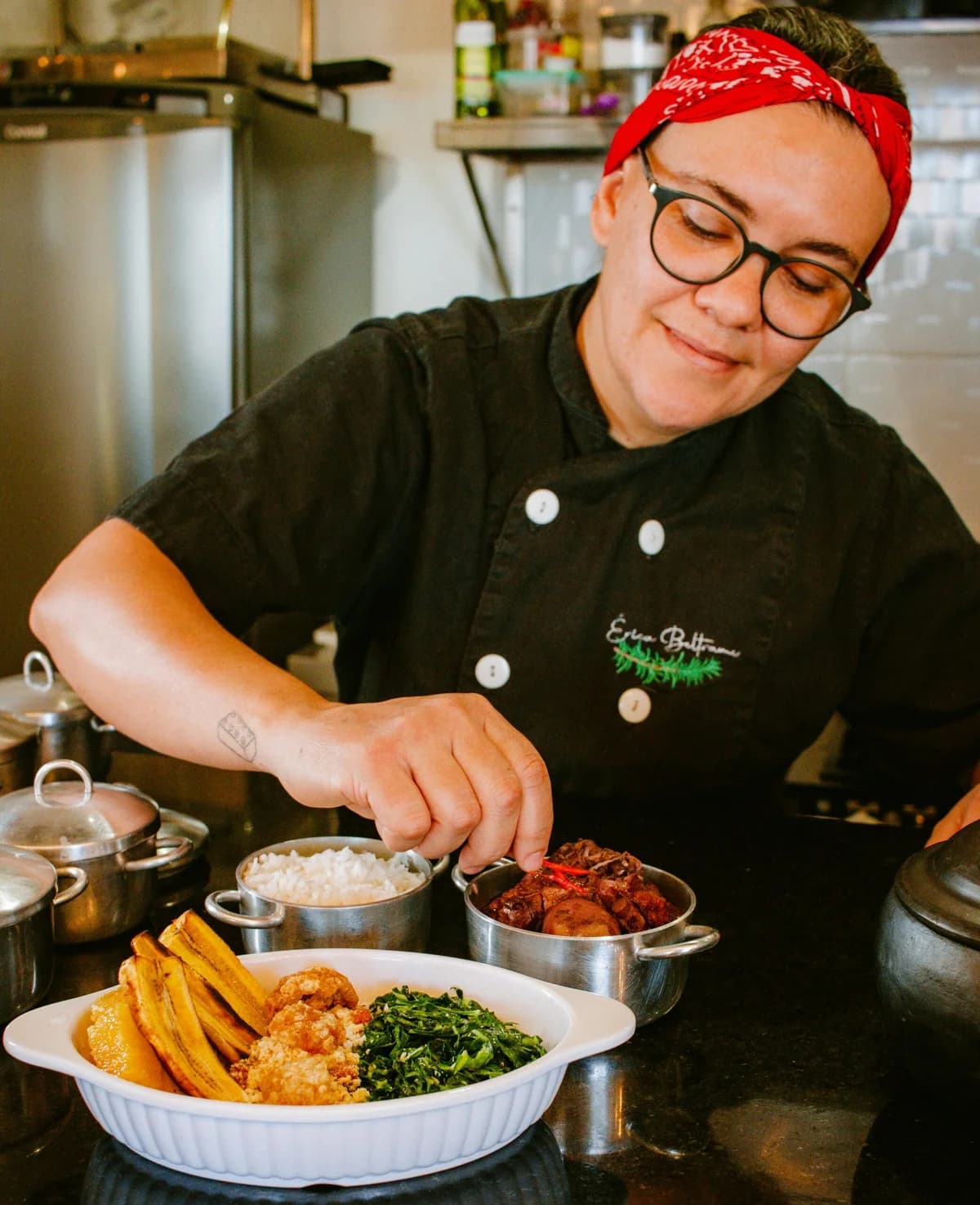 Embroidered workwear: black chef jacket with a name and motif stitched on the chest